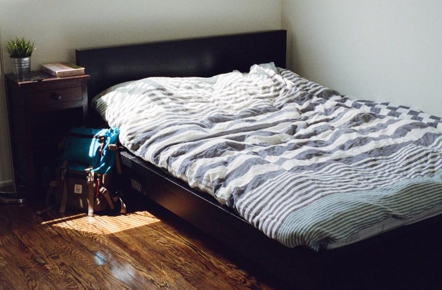 Bed with a dark wooden frame